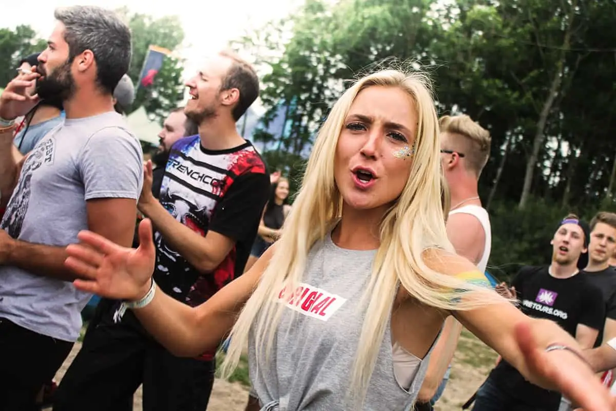 A traveller doing the Swedish midsummer dance at Defqon.1 2017